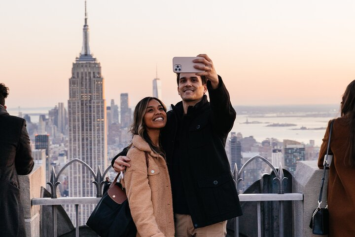 Experience breathtaking views from above capturing memories with the iconic skyline as your backdrop including the Empire State Building and beyond at Top of the Rock Observation Deck.